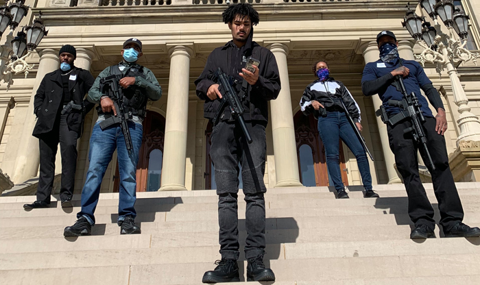 Armed black citizens escort Michigan lawmaker to capitol after volatile rightwing protest